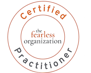the Fearless Organization Scan Badge - Orange and Grey text on a white background
